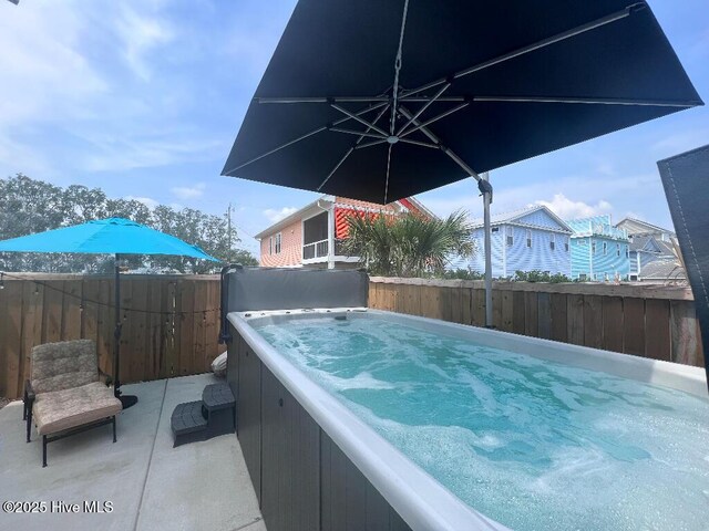 302 Alabama Ave Unit 2, Carolina Beach, NC 28428 - view of swimming pool with a hot tub