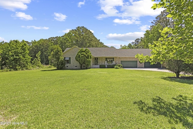 418 Grants Creek Rd, Jacksonville, NC 28546 - view of front of home with an attached garage, a front yard, concrete driveway, and brick siding