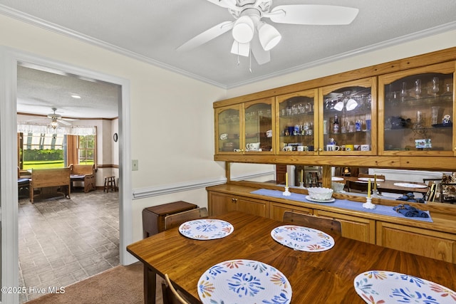 418 Grants Creek Rd, Jacksonville, NC 28546 - dining space with ceiling fan and crown molding