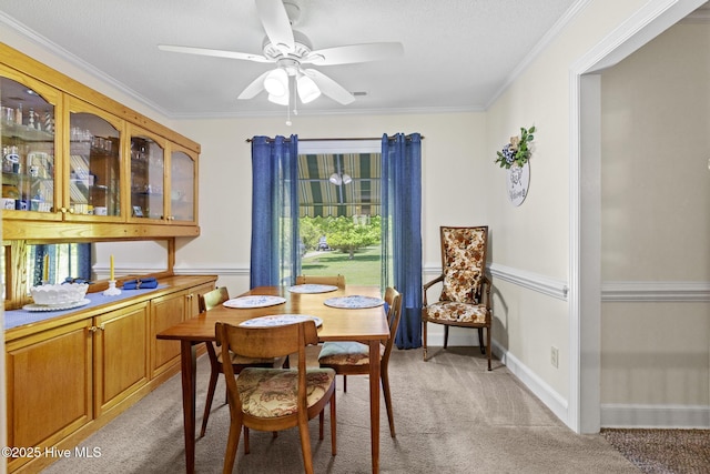 418 Grants Creek Rd, Jacksonville, NC 28546 - dining space featuring light carpet, a ceiling fan, and ornamental molding