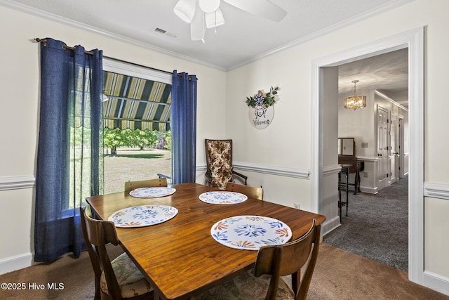 418 Grants Creek Rd, Jacksonville, NC 28546 - dining area with carpet floors, a ceiling fan, a chandelier, crown molding, and baseboards