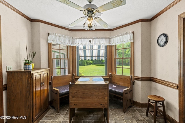 418 Grants Creek Rd, Jacksonville, NC 28546 - dining area featuring a textured ceiling, ornamental molding, ceiling fan, a textured wall, and baseboards