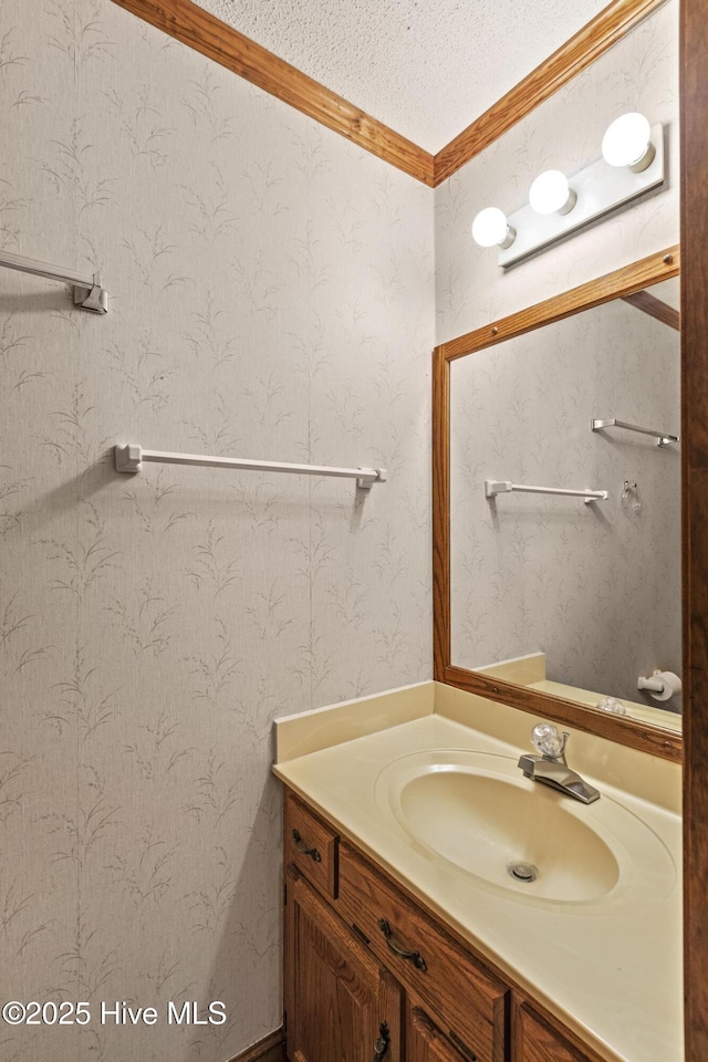 418 Grants Creek Rd, Jacksonville, NC 28546 - bathroom with vanity, crown molding, and a textured ceiling
