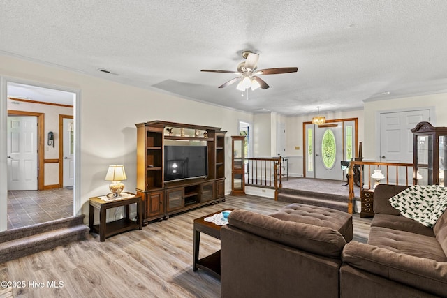 418 Grants Creek Rd, Jacksonville, NC 28546 - living area featuring a ceiling fan, a textured ceiling, crown molding, light wood-style floors, and baseboards
