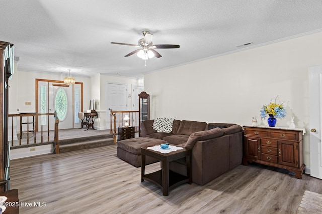 418 Grants Creek Rd, Jacksonville, NC 28546 - living room featuring light wood-style flooring, a ceiling fan, and a textured ceiling