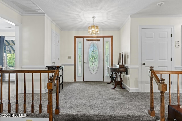 418 Grants Creek Rd, Jacksonville, NC 28546 - entryway featuring carpet, a chandelier, and crown molding