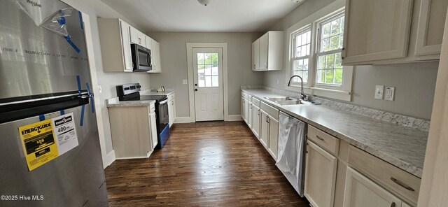 107 Carolina Ave, Clinton, NC 28328 - kitchen with appliances with stainless steel finishes, a sink, dark wood-style floors, and baseboards