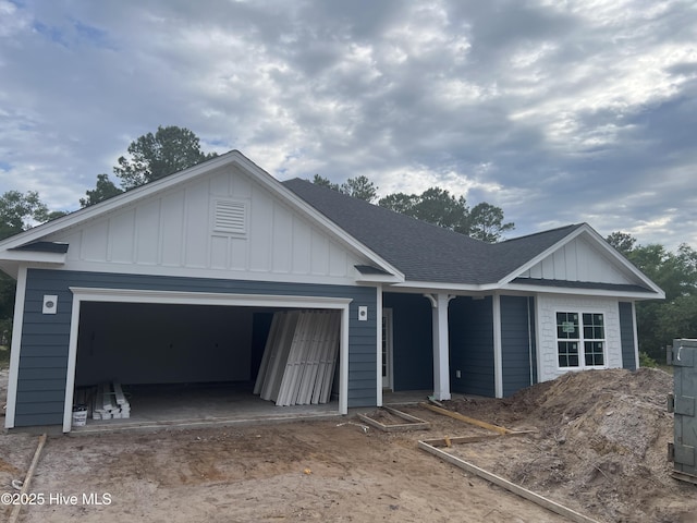 3035 Old Berwick St SW, Shallotte, NC 28470 - single story home with board and batten siding, a shingled roof, and an attached garage