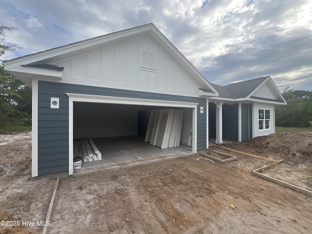 3035 Old Berwick St SW, Shallotte, NC 28470 - view of front of property with board and batten siding and a garage