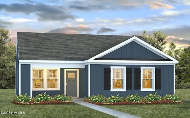 276 N Atlantic Ave Lot 187, Wilmington, NC 28411 - view of front of home featuring a shingled roof and a lawn