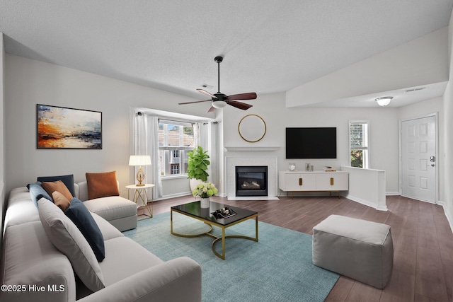 4109 Breezewood Dr Unit 204, Wilmington, NC 28412 - living area with wood finished floors, ceiling fan, a fireplace with flush hearth, a textured ceiling, and baseboards