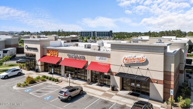 4109 Breezewood Dr Unit 204, Wilmington, NC 28412 - view of building exterior featuring uncovered parking
