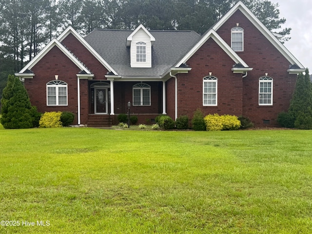 315 Hunters Creek Dr, Goldsboro, NC 27534 - view of front of property featuring brick siding, a front lawn, covered porch, crawl space, and a shingled roof