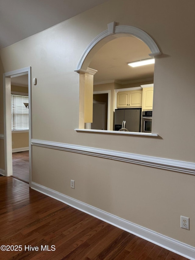 315 Hunters Creek Dr, Goldsboro, NC 27534 - kitchen featuring stainless steel appliances, arched walkways, baseboards, and wood finished floors