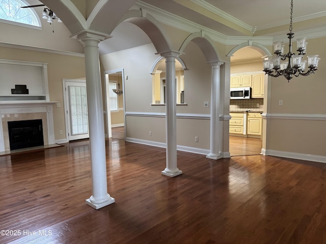 315 Hunters Creek Dr, Goldsboro, NC 27534 - unfurnished living room with a tile fireplace, dark wood finished floors, crown molding, and baseboards