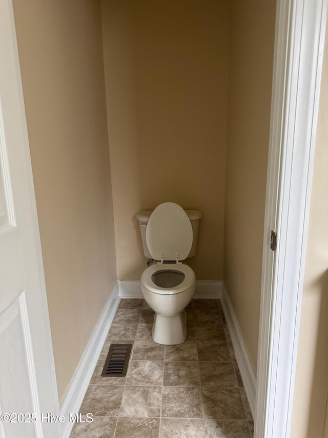 315 Hunters Creek Dr, Goldsboro, NC 27534 - bathroom with toilet and baseboards