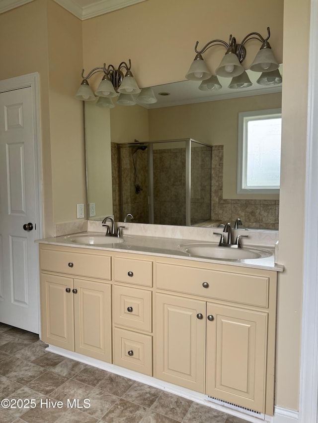 315 Hunters Creek Dr, Goldsboro, NC 27534 - bathroom with double vanity, a shower stall, and crown molding