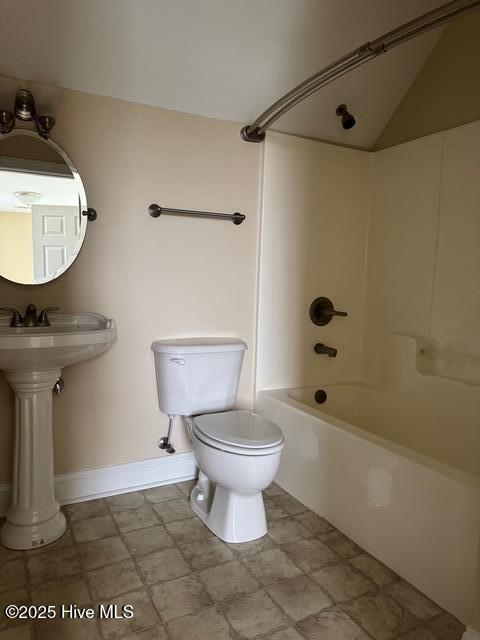 315 Hunters Creek Dr, Goldsboro, NC 27534 - bathroom with toilet, bathtub / shower combination, baseboards, and a sink