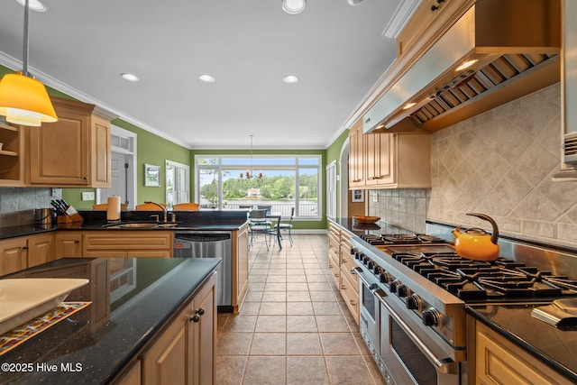 118 Douglas Dr, West End, NC 27376 - kitchen featuring stainless steel appliances, premium range hood, backsplash, hanging light fixtures, and recessed lighting