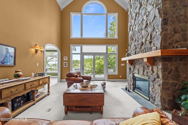 118 Douglas Dr, West End, NC 27376 - carpeted living area with crown molding, a stone fireplace, and high vaulted ceiling