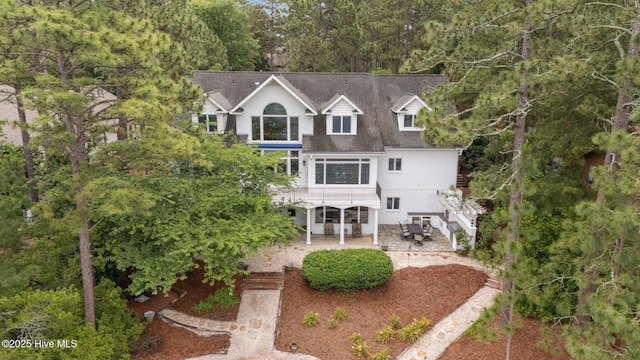 118 Douglas Dr, West End, NC 27376 - rear view of property featuring stairway, a patio area, and roof with shingles