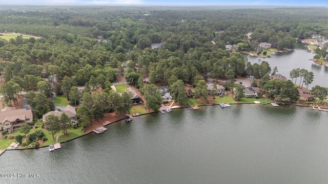 118 Douglas Dr, West End, NC 27376 - aerial perspective of suburban area featuring a heavily wooded area and a nearby body of water