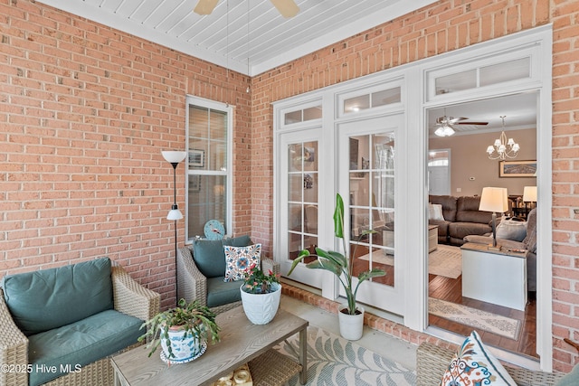 4239 Ashfield Pl, Southport, NC 28461 - sunroom with ceiling fan and a chandelier