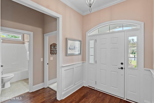 4239 Ashfield Pl, Southport, NC 28461 - entryway featuring crown molding and dark wood-style flooring