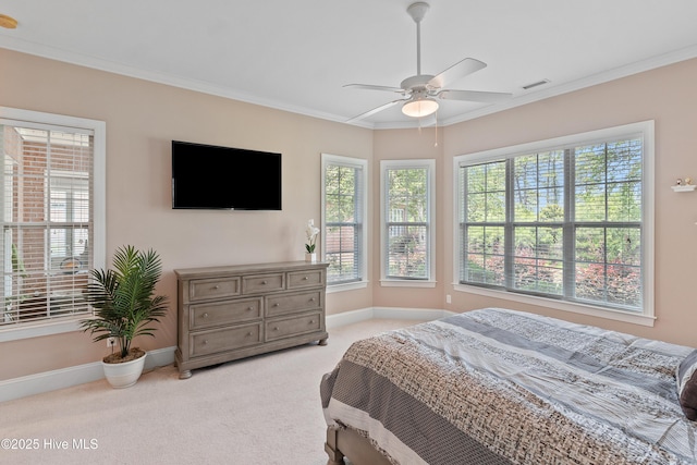 4239 Ashfield Pl, Southport, NC 28461 - bedroom featuring light carpet, multiple windows, baseboards, ornamental molding, and a ceiling fan
