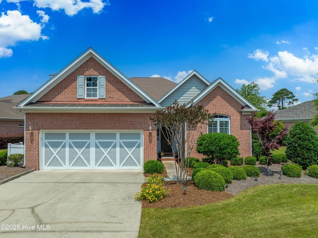4239 Ashfield Pl, Southport, NC 28461 - view of front of house with brick siding, concrete driveway, and a front yard