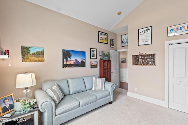 4239 Ashfield Pl, Southport, NC 28461 - living area featuring carpet floors, vaulted ceiling, and baseboards