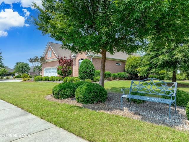 4239 Ashfield Pl, Southport, NC 28461 - view of side of property featuring a lawn and brick siding