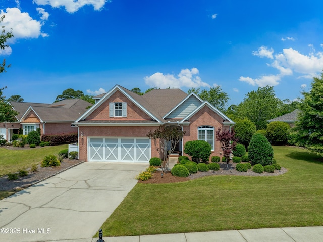 4239 Ashfield Pl, Southport, NC 28461 - view of front of house with brick siding, concrete driveway, and a front yard