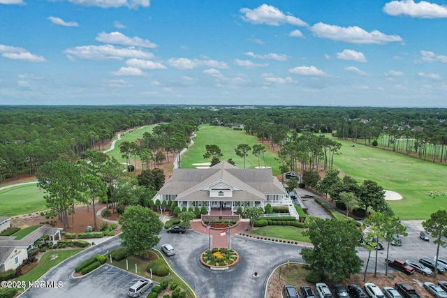 4239 Ashfield Pl, Southport, NC 28461 - drone / aerial view of a local golf course and a heavily wooded area