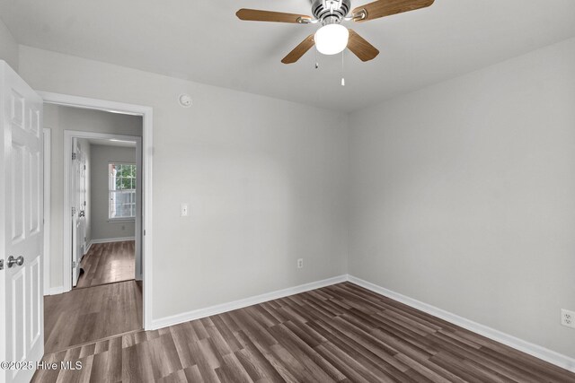 1428 Forest Hill Dr, Leland, NC 28451 - spare room with dark wood finished floors, baseboards, and ceiling fan