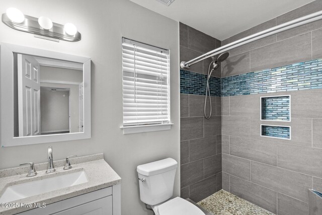 1428 Forest Hill Dr, Leland, NC 28451 - full bath featuring toilet, vanity, and a tile shower