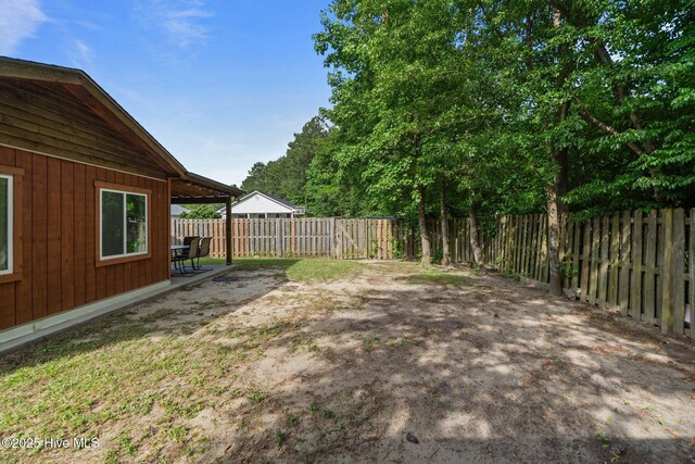 1428 Forest Hill Dr, Leland, NC 28451 - fenced backyard with a patio area