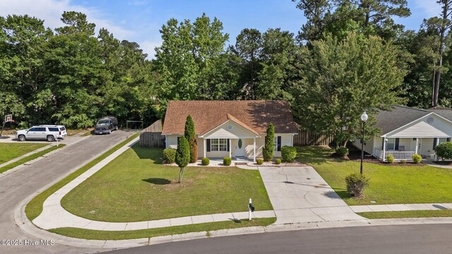 1428 Forest Hill Dr, Leland, NC 28451 - ranch-style home with covered porch, a front yard, driveway, and roof with shingles