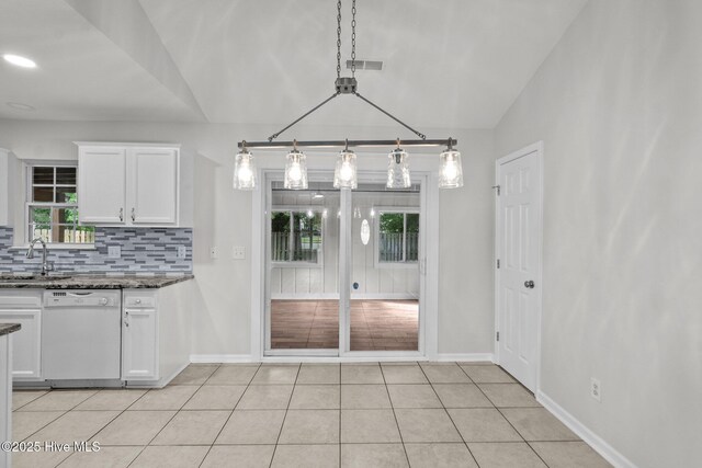 1428 Forest Hill Dr, Leland, NC 28451 - kitchen featuring dishwasher, backsplash, dark stone counters, white cabinetry, and a sink