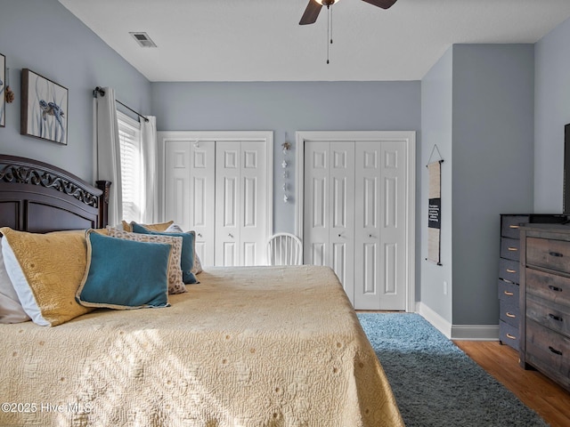 300 Lighthouse Ln Unit C2, Cedar Point, NC 28584 - bedroom with multiple closets, wood finished floors, baseboards, and a ceiling fan