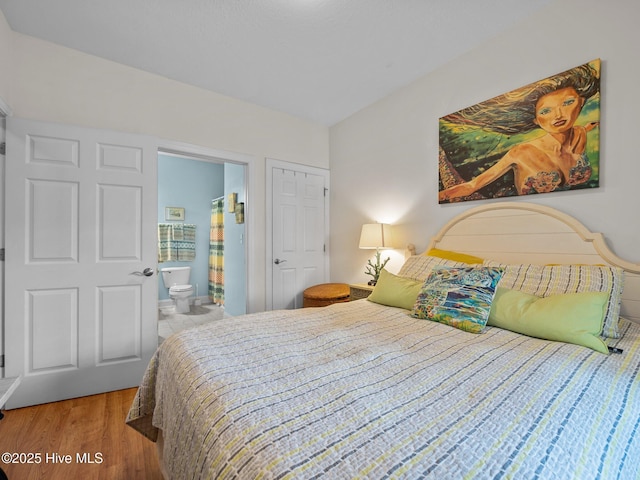 300 Lighthouse Ln Unit C2, Cedar Point, NC 28584 - bedroom with wood finished floors and ensuite bath