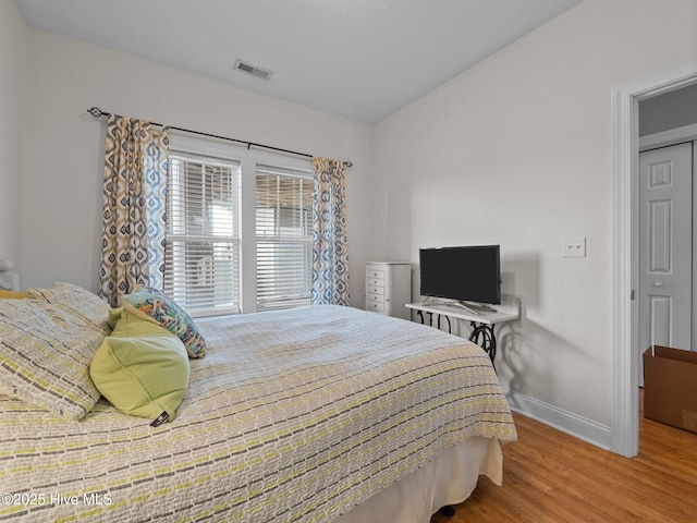 300 Lighthouse Ln Unit C2, Cedar Point, NC 28584 - bedroom featuring baseboards and wood finished floors