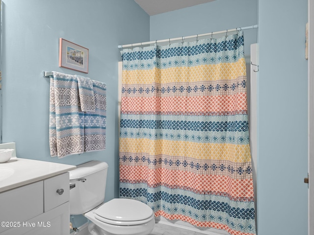 300 Lighthouse Ln Unit C2, Cedar Point, NC 28584 - full bathroom with toilet, vanity, a shower with shower curtain, and marble look tile flooring