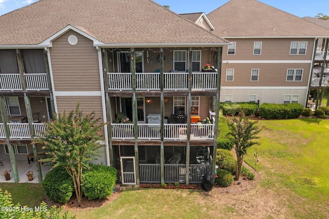 300 Lighthouse Ln Unit C2, Cedar Point, NC 28584 - back of house featuring roof with shingles and a lawn