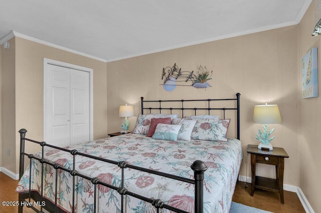 101 W First St # A2, Ocean Isle Beach, NC 28469 - bedroom featuring wood finished floors, crown molding, baseboards, and a closet