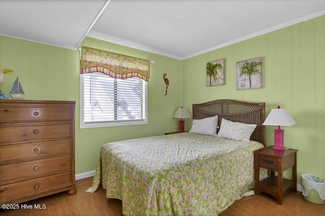 101 W First St # A2, Ocean Isle Beach, NC 28469 - bedroom featuring wood finished floors and ornamental molding