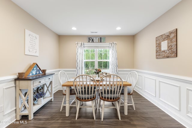 849 Rolling Pines Loop Rd, Leland, NC 28451 - dining area featuring a decorative wall, dark wood-type flooring, wainscoting, and recessed lighting