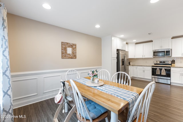849 Rolling Pines Loop Rd, Leland, NC 28451 - dining space featuring dark wood-style floors, a wainscoted wall, recessed lighting, and a decorative wall