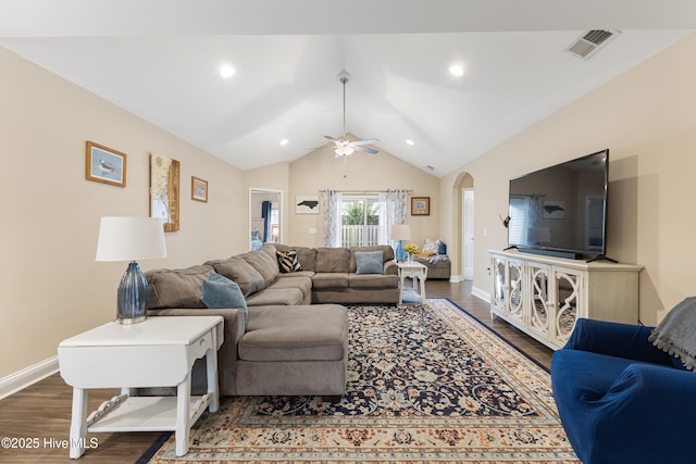 849 Rolling Pines Loop Rd, Leland, NC 28451 - living room with dark wood-style flooring, arched walkways, ceiling fan, lofted ceiling, and baseboards