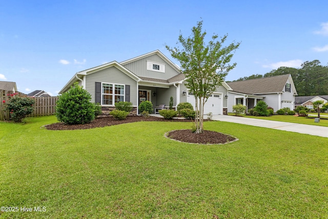 849 Rolling Pines Loop Rd, Leland, NC 28451 - view of front of home with board and batten siding, driveway, and a garage